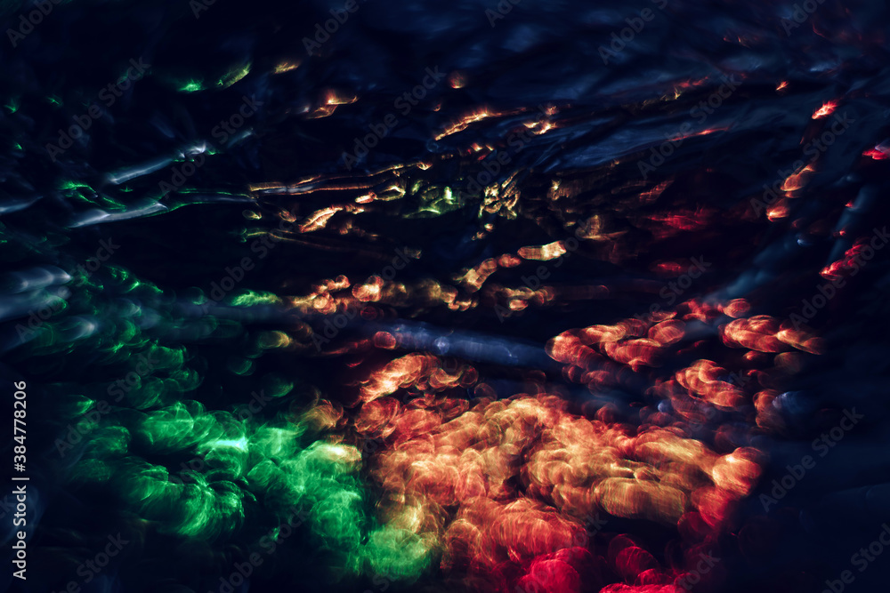 Aufkleber beautiful multi colored abstract optical light bokeh on a dark background..