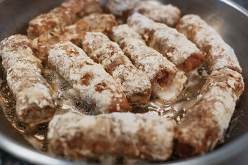 Fast food. Stuffed cutlets are fried in oil on the stove