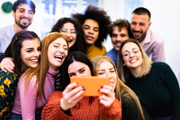 Happy friends multiracial taking selfie. Students having fun with technology trends. Youth, tech and friendship concept.