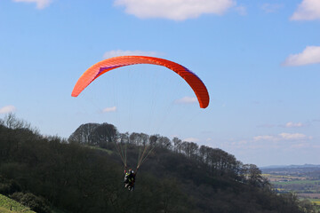 Paraglider flying at Combe Gibbet, England	