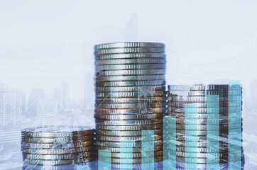 double exposure of city with row of coin stack with growth chart and graph progress report for business investment finance banking and money saving concept.