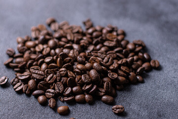 COFFEE BEANS ON DARK BACKGROUND