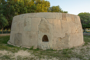 Remains of the Bronze Age round tomb with human and animal figures carved on it Hili Archaeological...