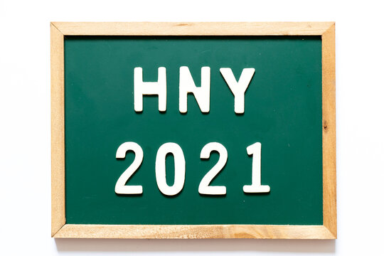 Green blackboard and wood frame with word HNY (Happy new year) 2021 on white background