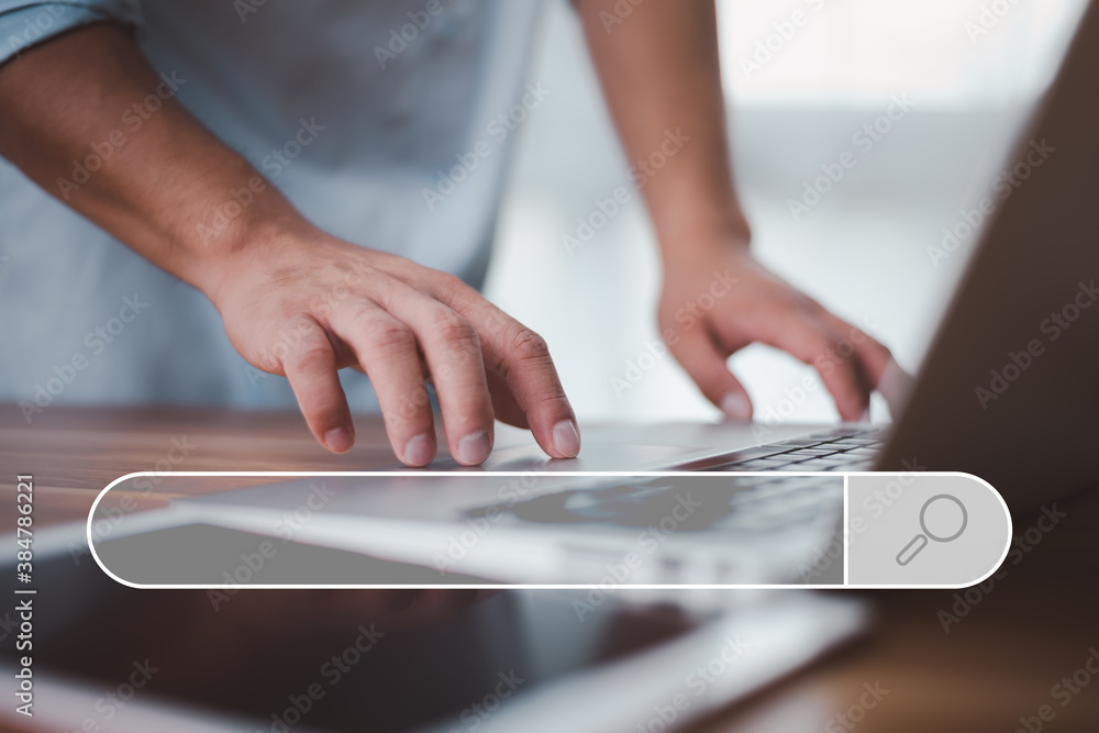 Fototapete Data Search Technology Search Engine Optimization. male hands are using a computer notebook to Searching for information.Using Search Console with your website.