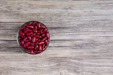Grains Red bean in bowl or spoon wood background. Red bean or kidney beans in bowl.