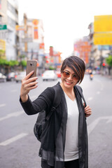 asian travel girl happy selfie with her mobile phone