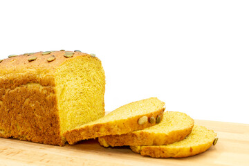 Loaf of pumpkin bread, seeds, sliced isolated in white background.