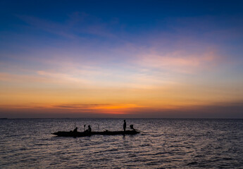 fishing boat at sunset in the evening