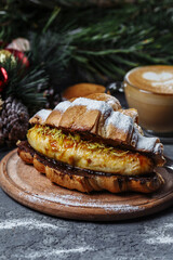 New Year's breakfast with croissants. New Year's croissant with chocolate and baked banana
