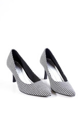 women's retro shoes with black and white pattern on heels isolated on a white background