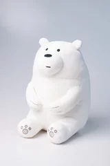 Keuken spatwand met foto White polar toy bear sits and looks at the light. Gray background. Cute plush toy © YarikL