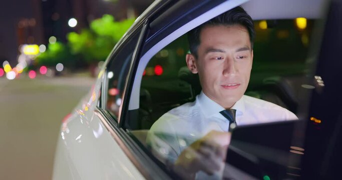 businessman use tablet in taxi