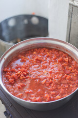 Canned tomato sauce, prepared at home.Harvesting for the winter. tomato sauce preparation for winter