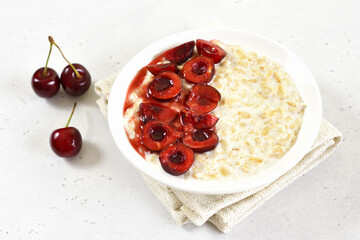 Oatmeal porridge with cherry slices
