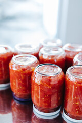 Canned tomato sauce, prepared at home.Harvesting for the winter. tomato sauce preparation for winter