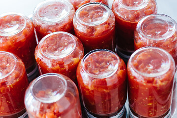 Canned tomato sauce, prepared at home.Harvesting for the winter. tomato sauce preparation for winter