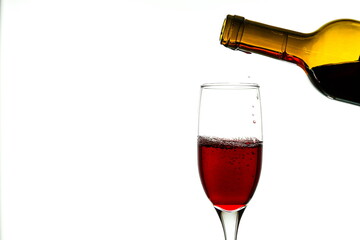 red wine bottle and glass on white background