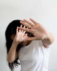 woman raised her hand for dissuade, campaign stop violence against women. International Women's Day