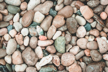 Beautiful background with colorful sea stones. Colorful round colorful sea stones. Close-up. For banner, background.