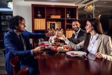Group of business people having dinner