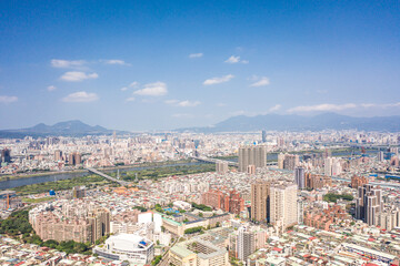 Fototapeta premium Asia business concept image, panoramic modern cityscape building bird’s eye view under daytime and blue sky, shot in Taipei, Taiwan.