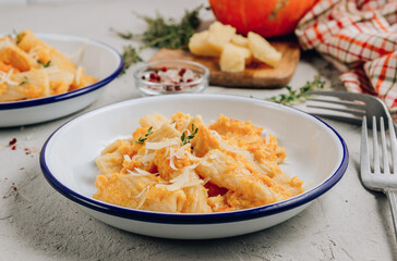 Creamy roasted butternut pumpkin tortiglioni pasta with parmesan cheese and thyme.