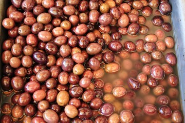Stall with Amfissa olives at street market in Athens, Greece.