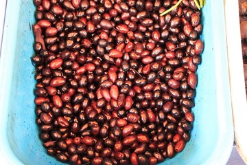 Stall with Kalamata or Kalamon olives at street market in Athens, Greece.