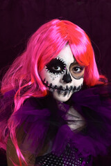 niña con maquillaje para halloween, colores purpura, catrina dia de los muertos