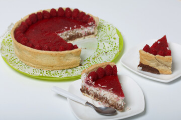 Levington sliced cake with raspberry jelly, chocolate and coconut. Garnished with raspberries.
