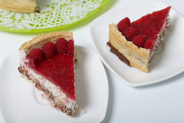 Levington sliced cake with raspberry jelly, chocolate and coconut. Garnished with raspberries.