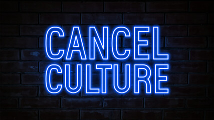 Cancel culture - blue neon light word on brick wall background