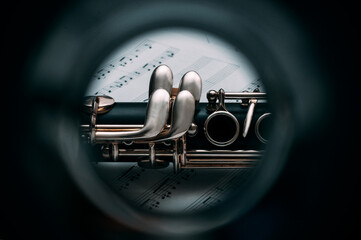 View through a clarinet tube and the musical notes