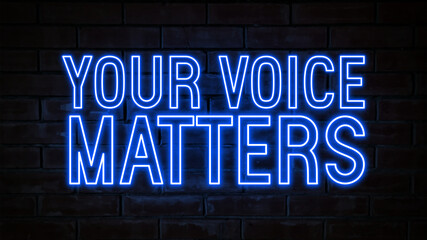 Your voice matters - blue neon light word on brick wall background