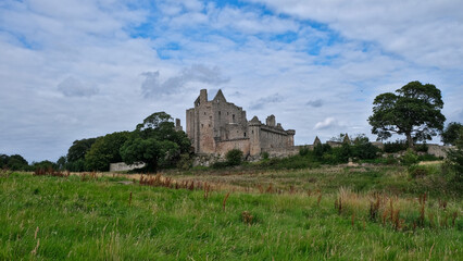 Summer photo of the famous Craigmillar Castle and gardens, home of Mary Queen of Scots in Edinburgh Scotland UK