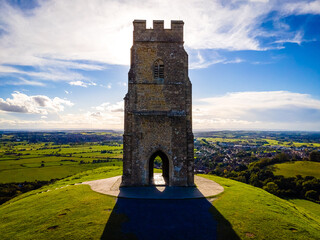 Glastonbury Tor near Glastonbury in the English county of Somerset, topped by the roofless St Michael's Tower, UK © Alexey Fedorenko