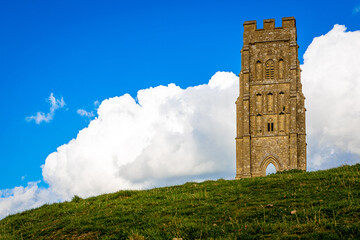 Glastonbury Tor near Glastonbury in the English county of Somerset, topped by the roofless St Michael's Tower, UK © Alexey Fedorenko