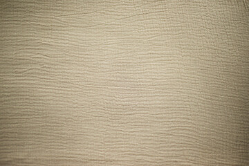 Fabric texture. Beige multi-layered muslin background for different designs. Textile theme.