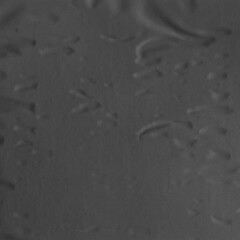 Black torn paper collage close-up. Texture made from various paper and cardboard parts. Damaged old paper background. Vintage blank wallpaper. Material design backdrop.