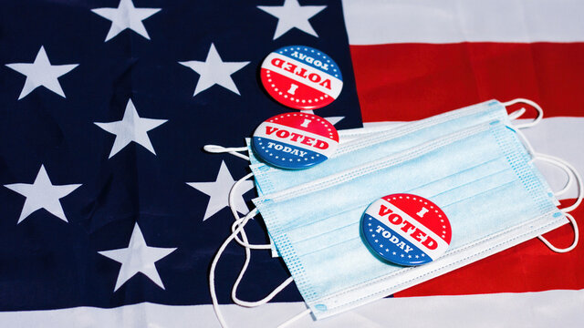 I voted today buttons on face mask with Usa flag. Coronavirus and presidential elections concept.