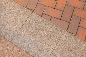 paving slabs of various shapes and sizes. Tiled texture background