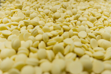 Field of many white chocolat pellets