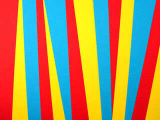 pile of colorful cardboard sheet, vibrant colored paper stacked into geometric