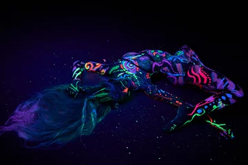 Foto op Plexiglas Art woman body art on the body dancing in ultraviolet light. Bright abstract drawings on the woman body neon color. Colored hair and face © angel_nt