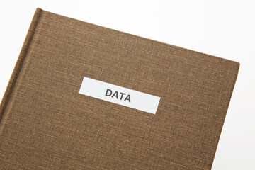 Brown data notebook reflects value of research. science, and facts