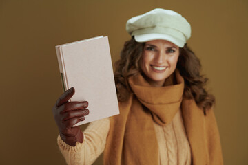 happy modern 40 years old woman in scarf on beige background