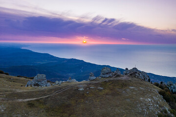 beautiful mountains at sunrise against the background of white clouds