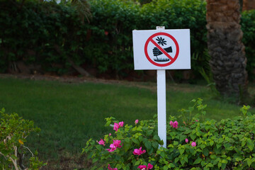 Sign with flowers in park