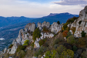 beautiful mountains with unusual ledges and tales against the background of the sky and the valley